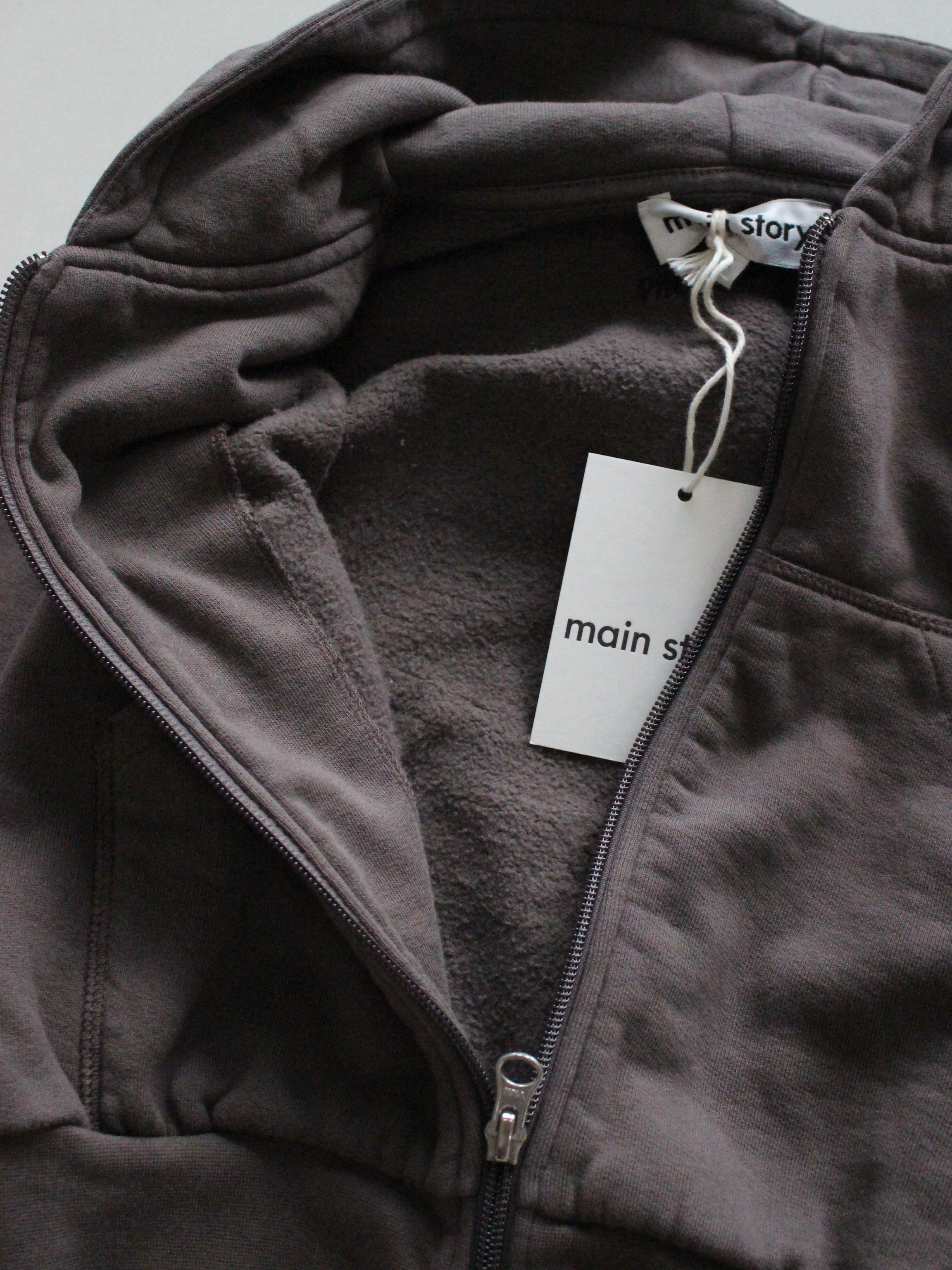 main story  Zipped Hoodie - Falcon